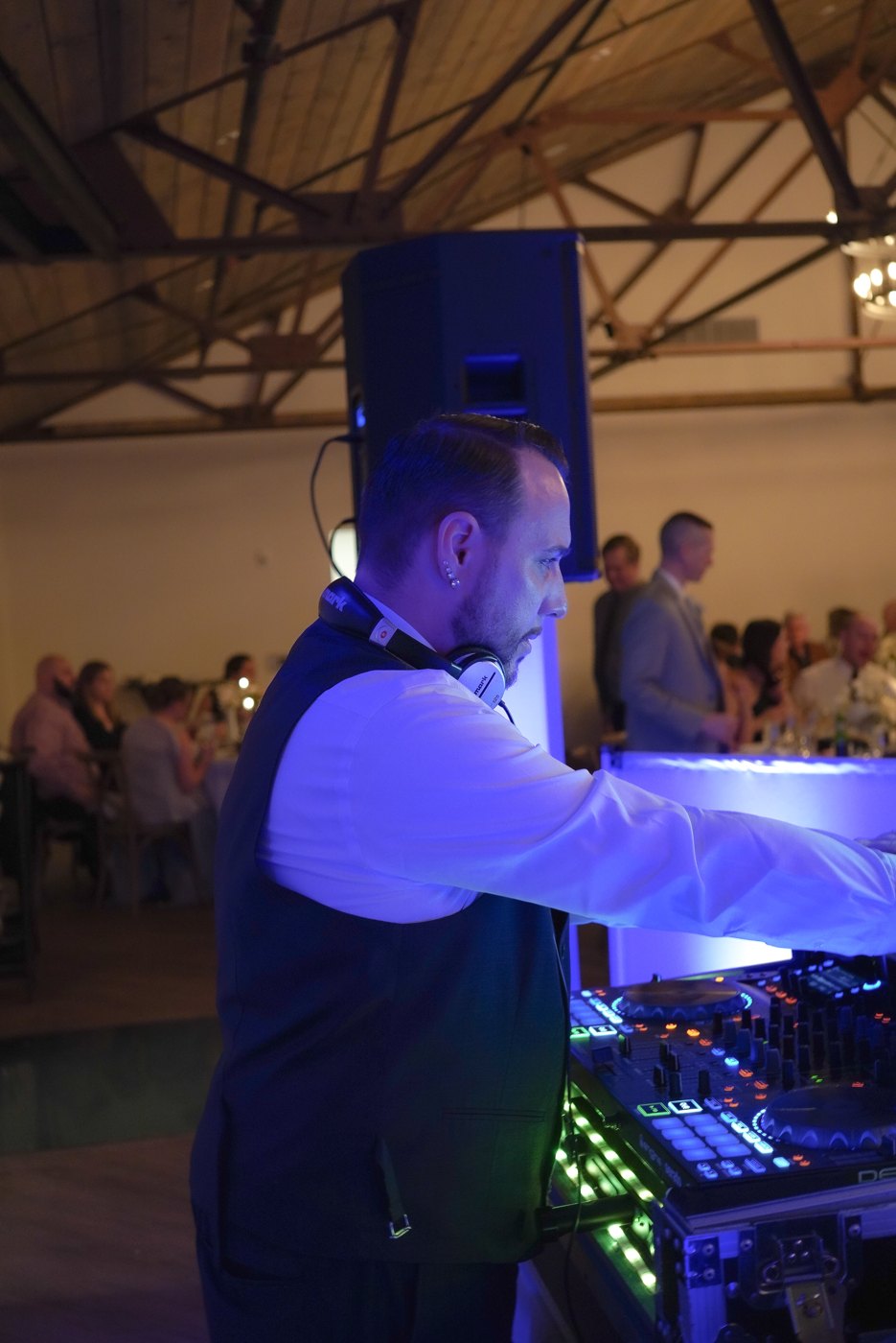 Barry working the decks with the wedding crowd behind him